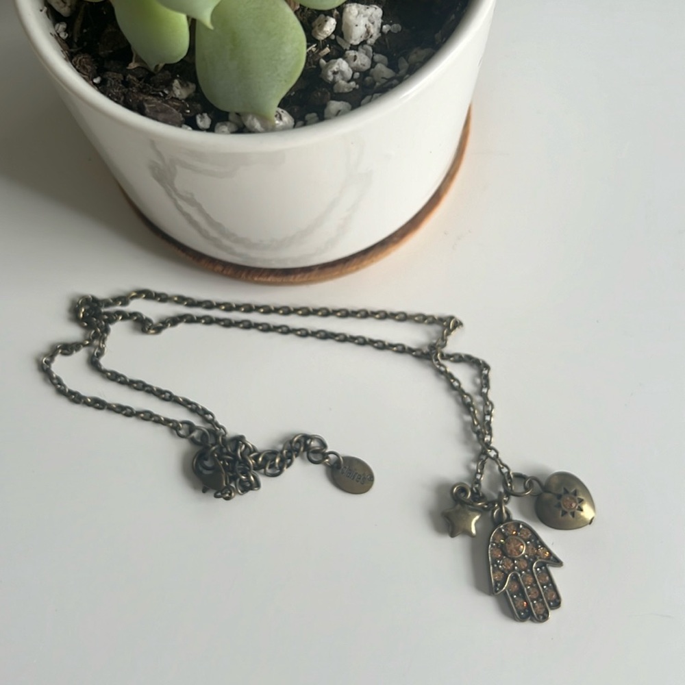Claire’s necklace with Hamsa Hand